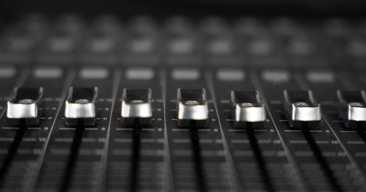Recording studio mixing console in dimmed light